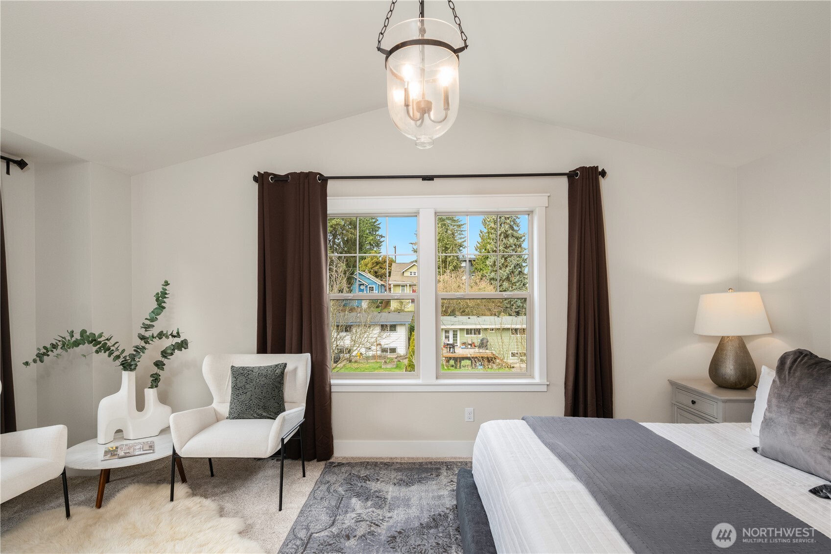7709 17th Avenue Southwest Seattle, WA 98106 - Photo 20 of 37 a bedroom with a large bed and a window