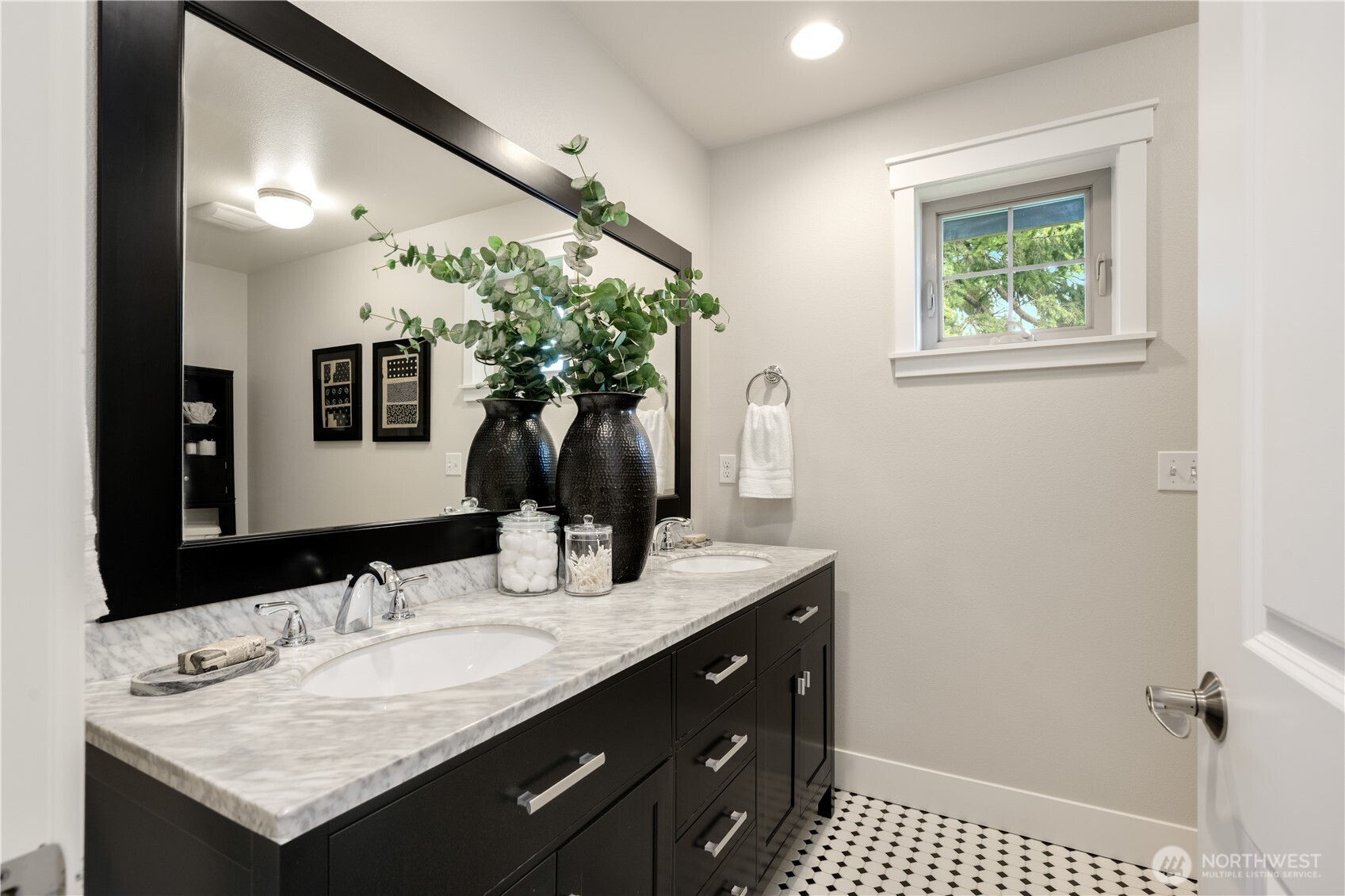 7709 17th Avenue Southwest Seattle, WA 98106 - Photo 21 of 37 a bathroom with a granite countertop sink and a mirror