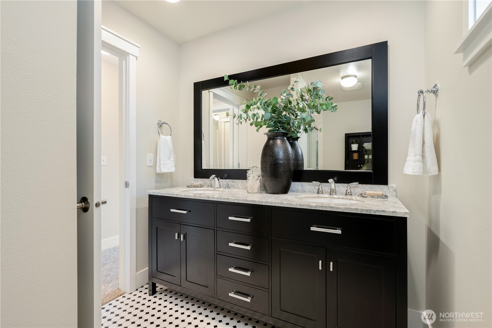 7709 17th Avenue Southwest Seattle, WA 98106 - Photo 22 of 37 a bathroom with a double vanity sink and mirror