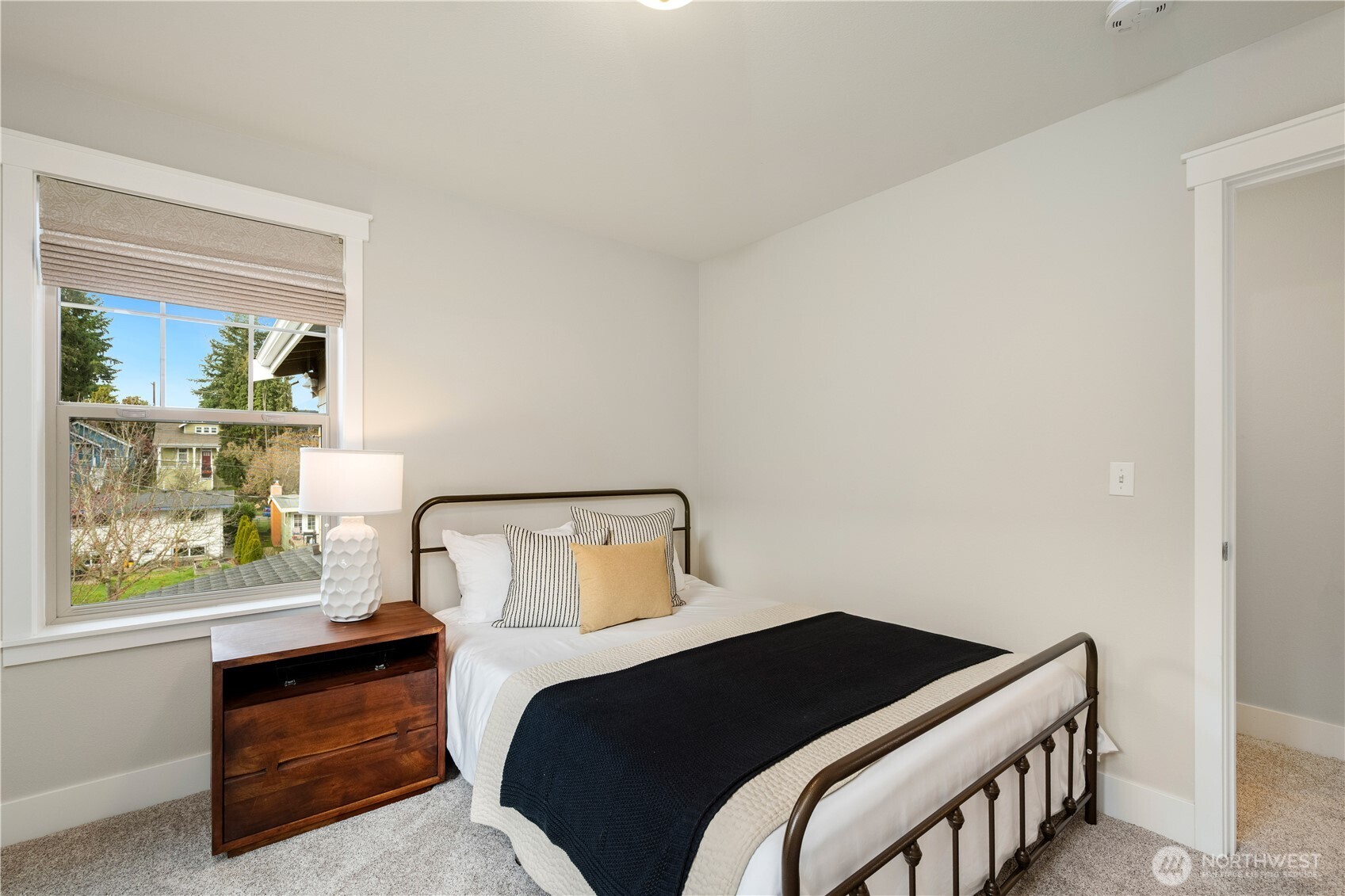 7709 17th Avenue Southwest Seattle, WA 98106 - Photo 25 of 37 a bedroom with a bed and window