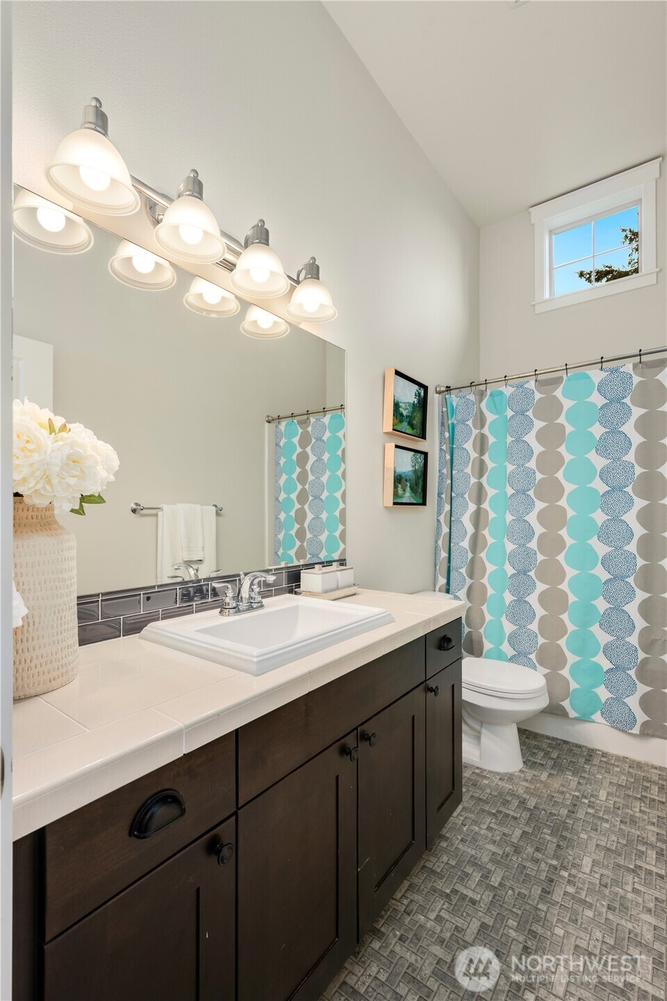 7709 17th Avenue Southwest Seattle, WA 98106 - Photo 26 of 37 a bathroom with a double vanity sink mirror and toilet