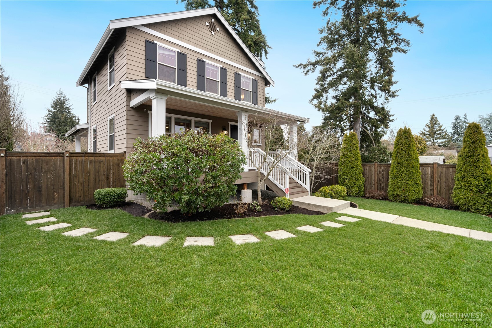 7709 17th Avenue Southwest Seattle, WA 98106 - Photo 3 of 37 a front view of a house with a yard