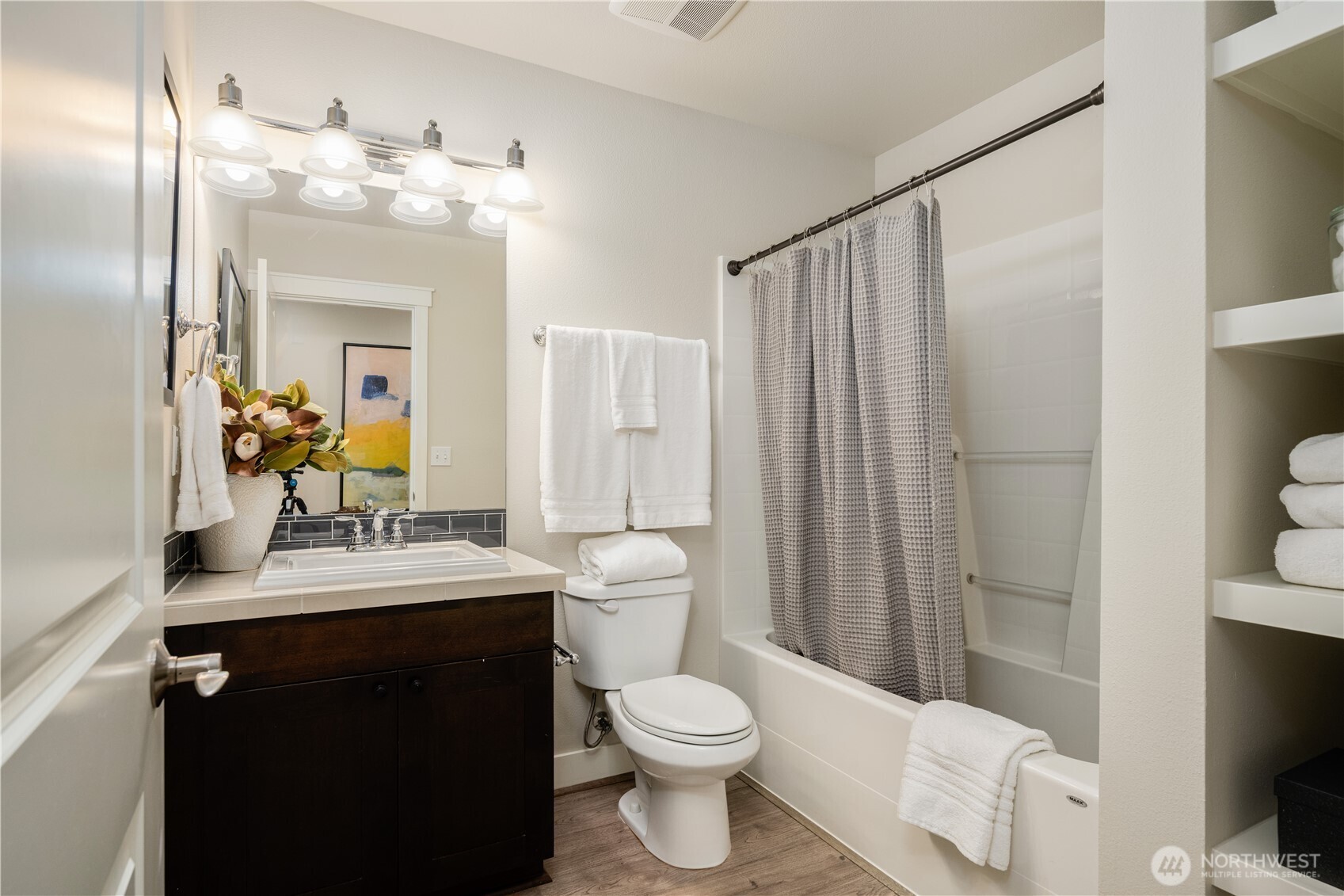 7709 17th Avenue Southwest Seattle, WA 98106 - Photo 33 of 37 a bathroom with a sink vanity mirror and toilet