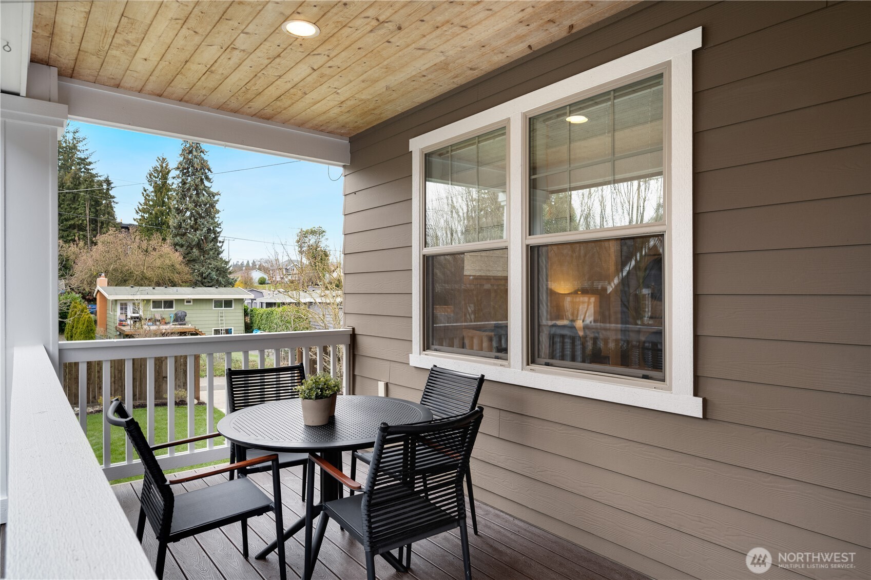 7709 17th Avenue Southwest Seattle, WA 98106 - Photo 35 of 37 a view of a balcony with table and chairs