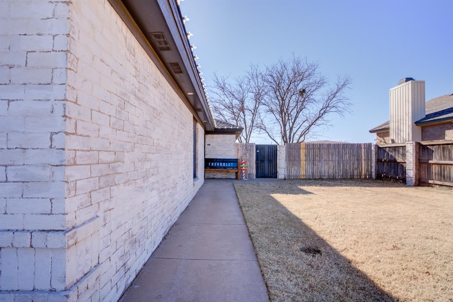 3409 103rd Street Lubbock, TX 79423 - Photo 3 of 33 a view of a house with a snow in the yard