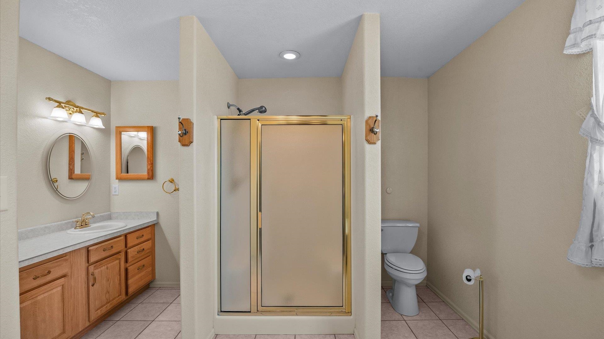 475 Los Broncos Road Whitewater, CO 81527 - Photo 17 of 41 a bathroom with a toilet a sink and a mirror