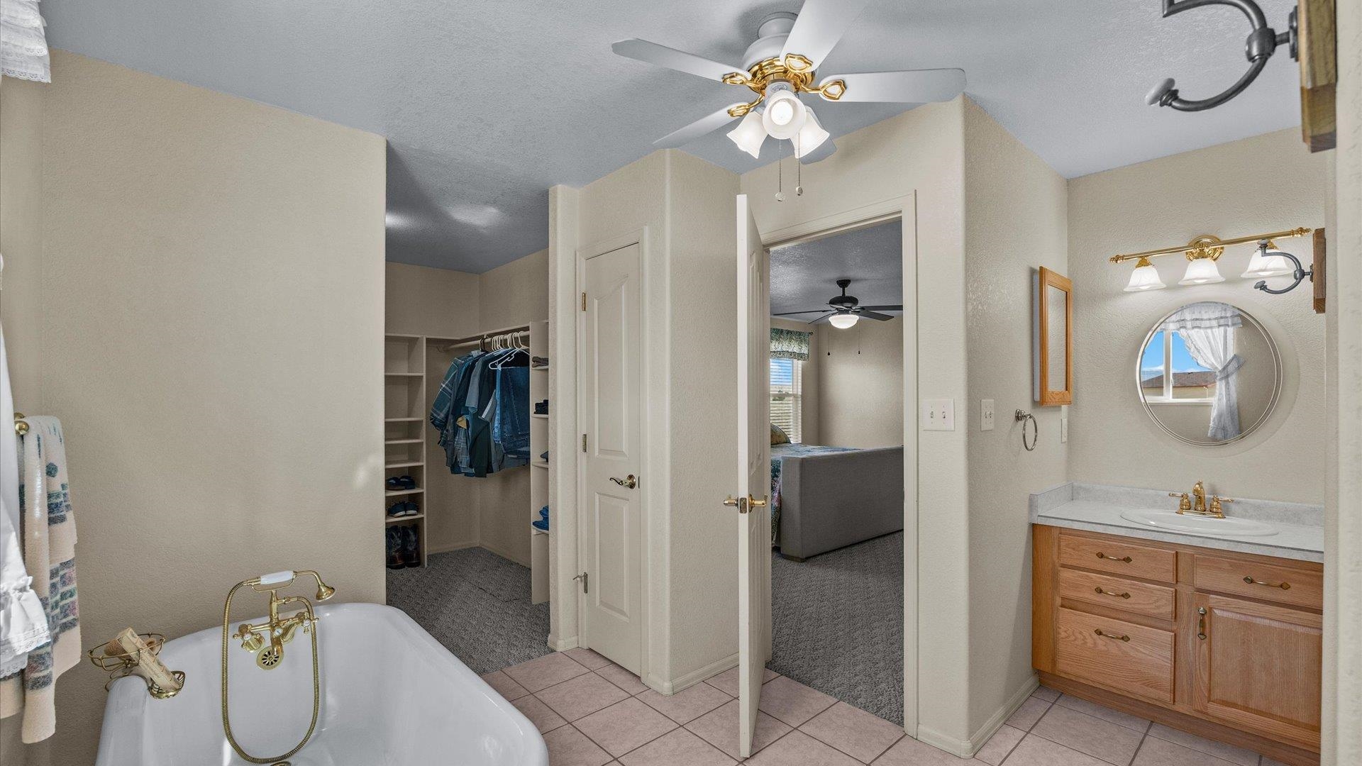 475 Los Broncos Road Whitewater, CO 81527 - Photo 18 of 41 a bathroom with a sink a toilet and shower