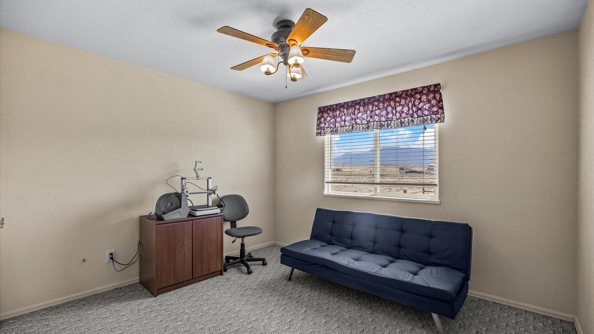 475 Los Broncos Road Whitewater, CO 81527 - Photo 19 of 41 a living room with furniture and a window