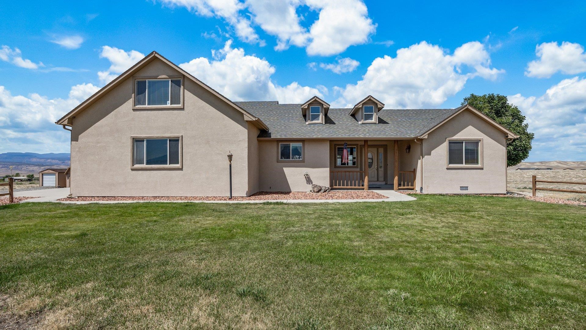 475 Los Broncos Road Whitewater, CO 81527 - Photo 4 of 41 a front view of a house with garden
