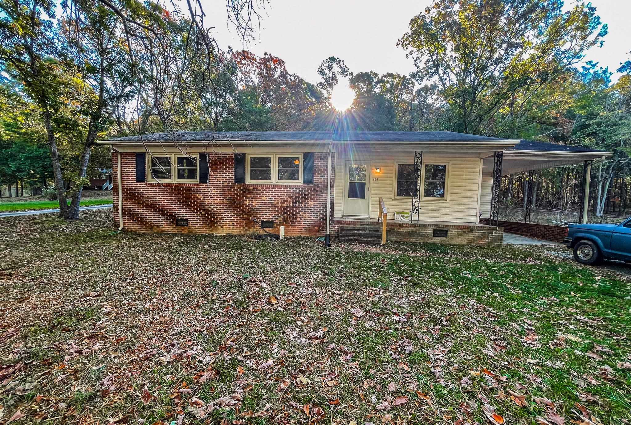 624 Frank Street Roxboro, NC 27573 - Photo 1 of 22 a front view of a house with garden
