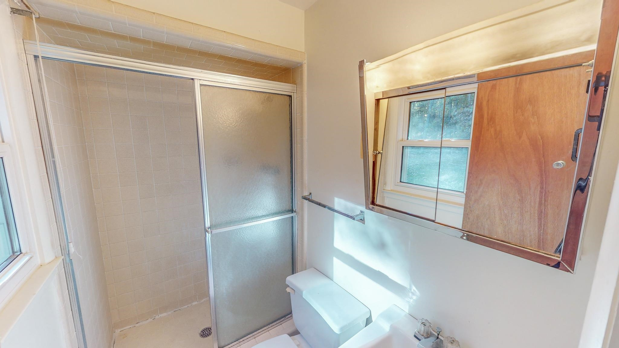 624 Frank Street Roxboro, NC 27573 - Photo 13 of 22 a bathroom with a glass shower door