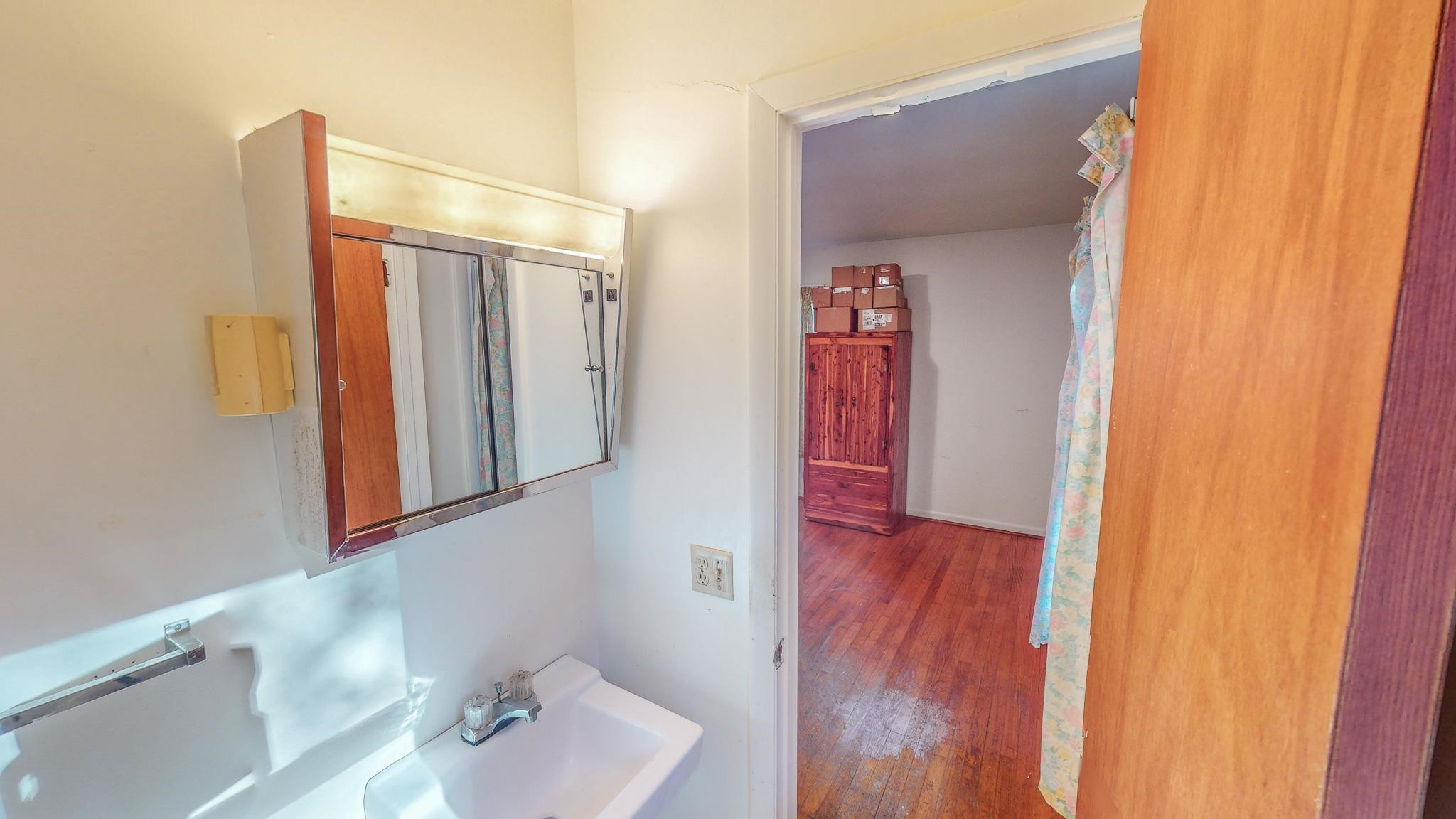 624 Frank Street Roxboro, NC 27573 - Photo 14 of 22 a bathroom with a sink and a mirror