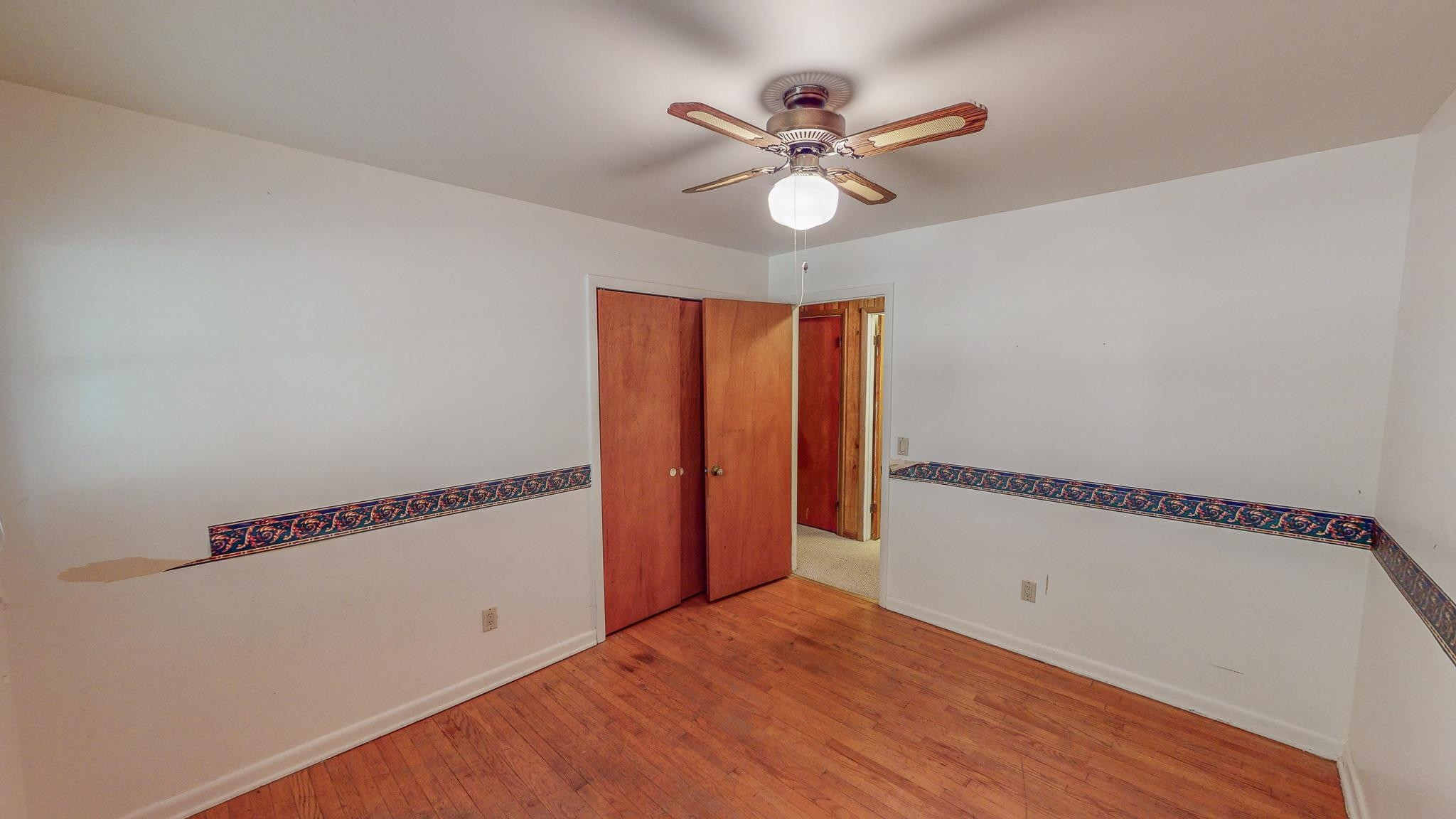 624 Frank Street Roxboro, NC 27573 - Photo 17 of 22 a view of a room with wooden floor and white walls