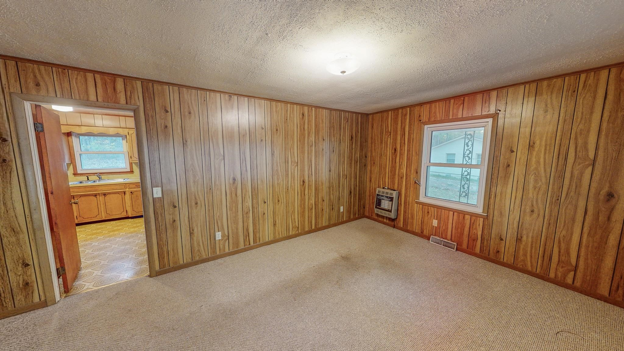 624 Frank Street Roxboro, NC 27573 - Photo 2 of 22 an empty room with windows