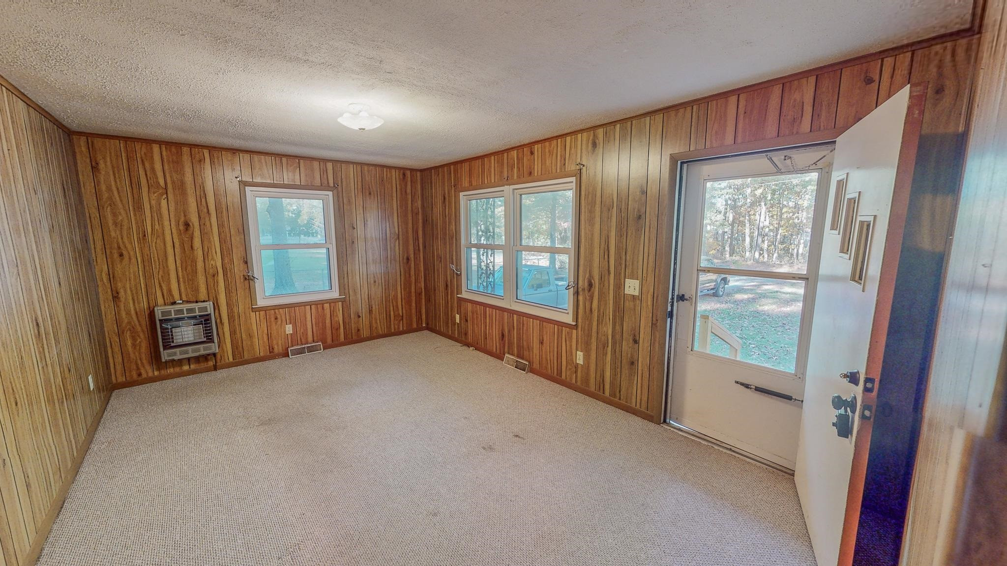 624 Frank Street Roxboro, NC 27573 - Photo 3 of 22 a view of an empty room with glass door and balcony