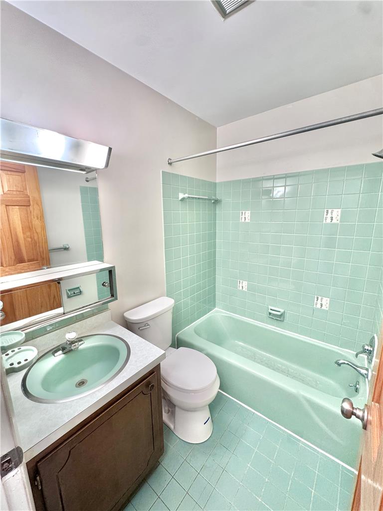 8325 Schantz Road Breinigsville, PA 18031 - Photo 11 of 21 A retro-inspired bathroom features charming tiled walls and a coordinating basin and tub.