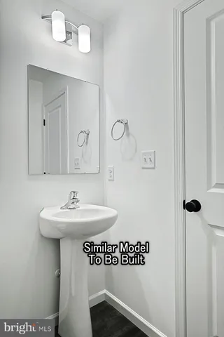 a bathroom with a sink a mirror and a vanity