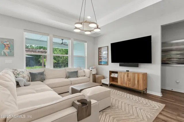 a bathroom with a sink a toilet and shower curtain
