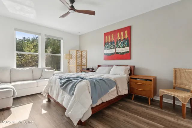 a view of a house with backyard porch and sitting area