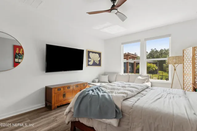 a front view of a house with a garden and yard