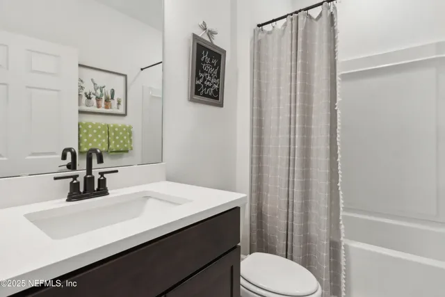 a view of a house with swimming pool and sitting area