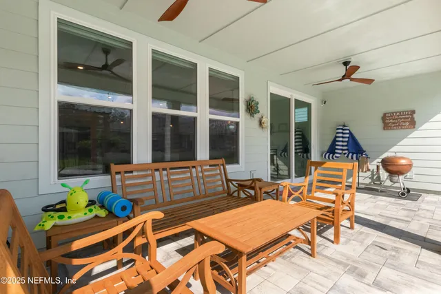 a living room with lots of furniture and a flat screen tv