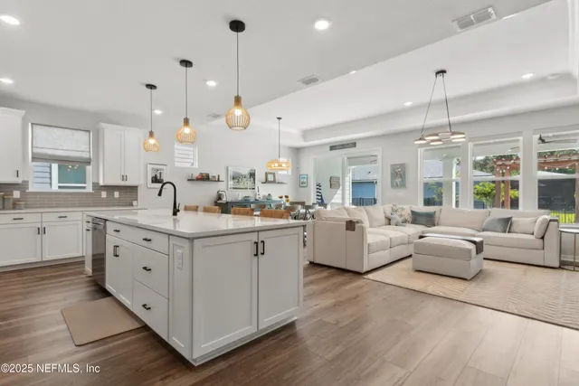 a kitchen with lots of clutter and cabinets