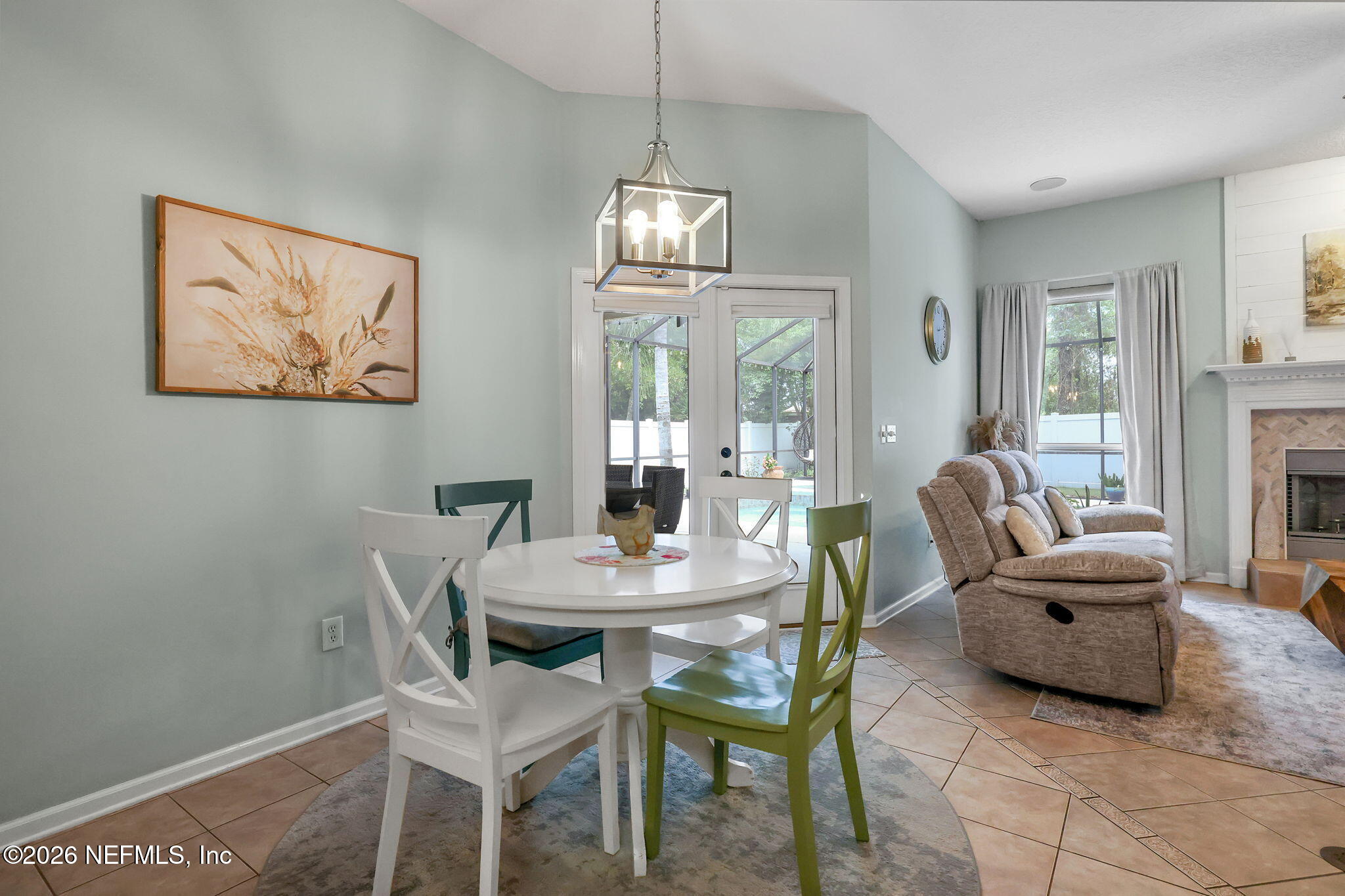 4320 Rye Court St. Johns, FL 32259 - Photo 18 of 60 a dining room with furniture a chandelier and wooden floor