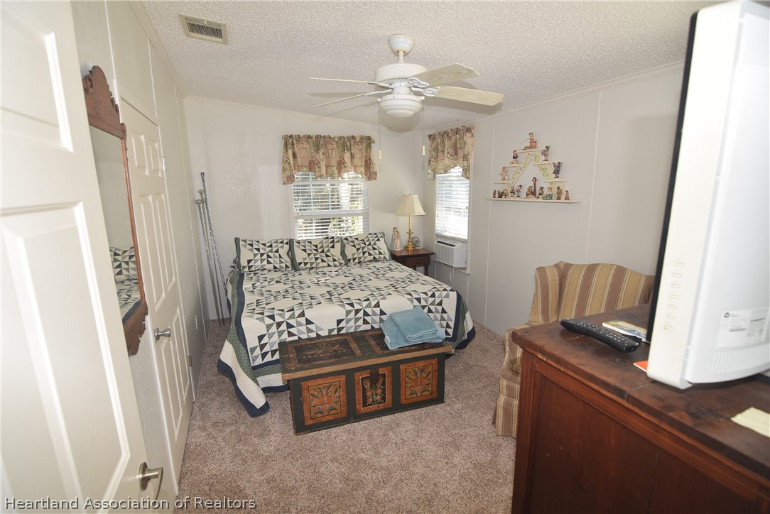 3124 White Oak Road Lorida, FL 33857 - Photo 19 of 34 a bedroom with a bed and window