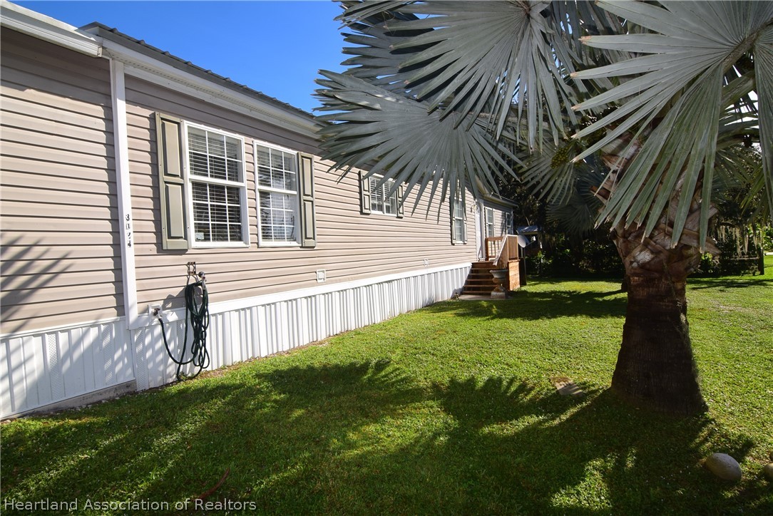 3124 White Oak Road Lorida, FL 33857 - Photo 4 of 34 a view of a house with a yard