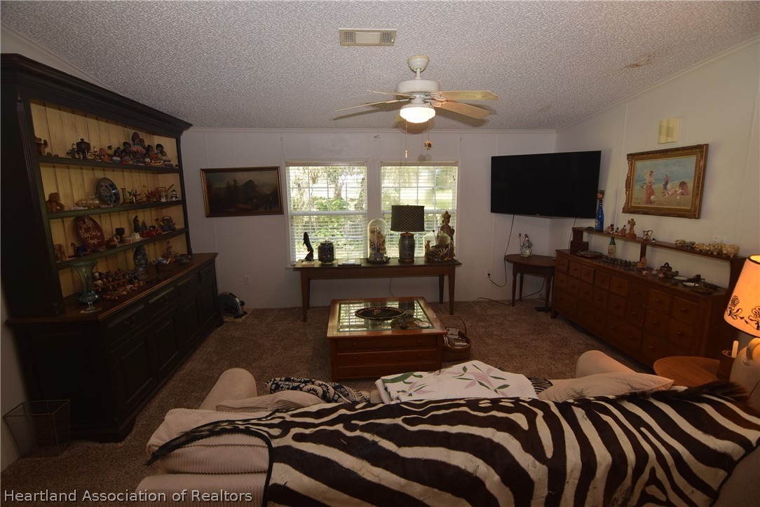 3124 White Oak Road Lorida, FL 33857 - Photo 10 of 34 a bedroom with a bed and large window