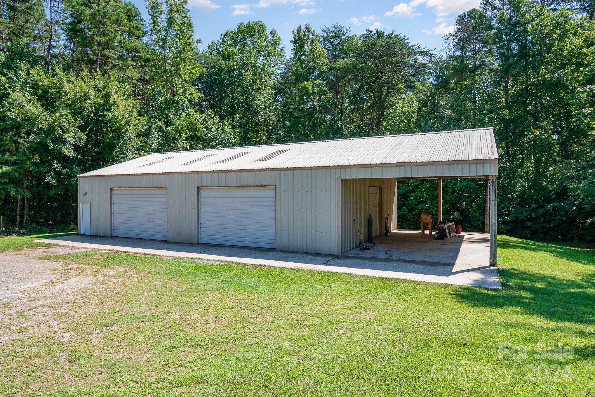 710 Rothrock Road Rockwell, NC 28138 - Photo 23 of 29 a view of a house with a yard porch and sitting area
