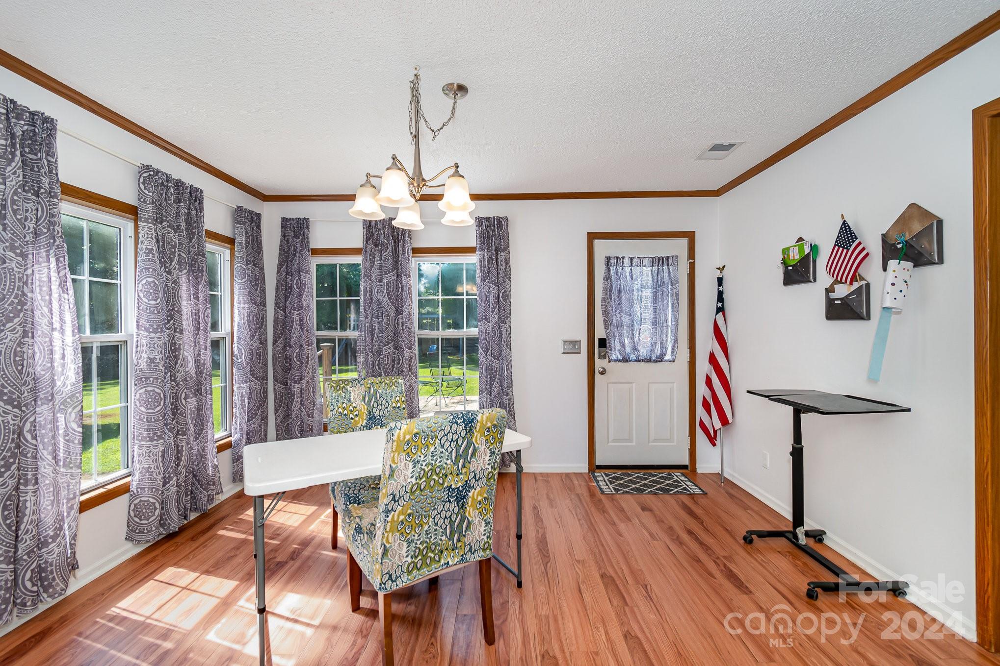 710 Rothrock Road Rockwell, NC 28138 - Photo 5 of 29 a view of a dining room with furniture window and wooden floor