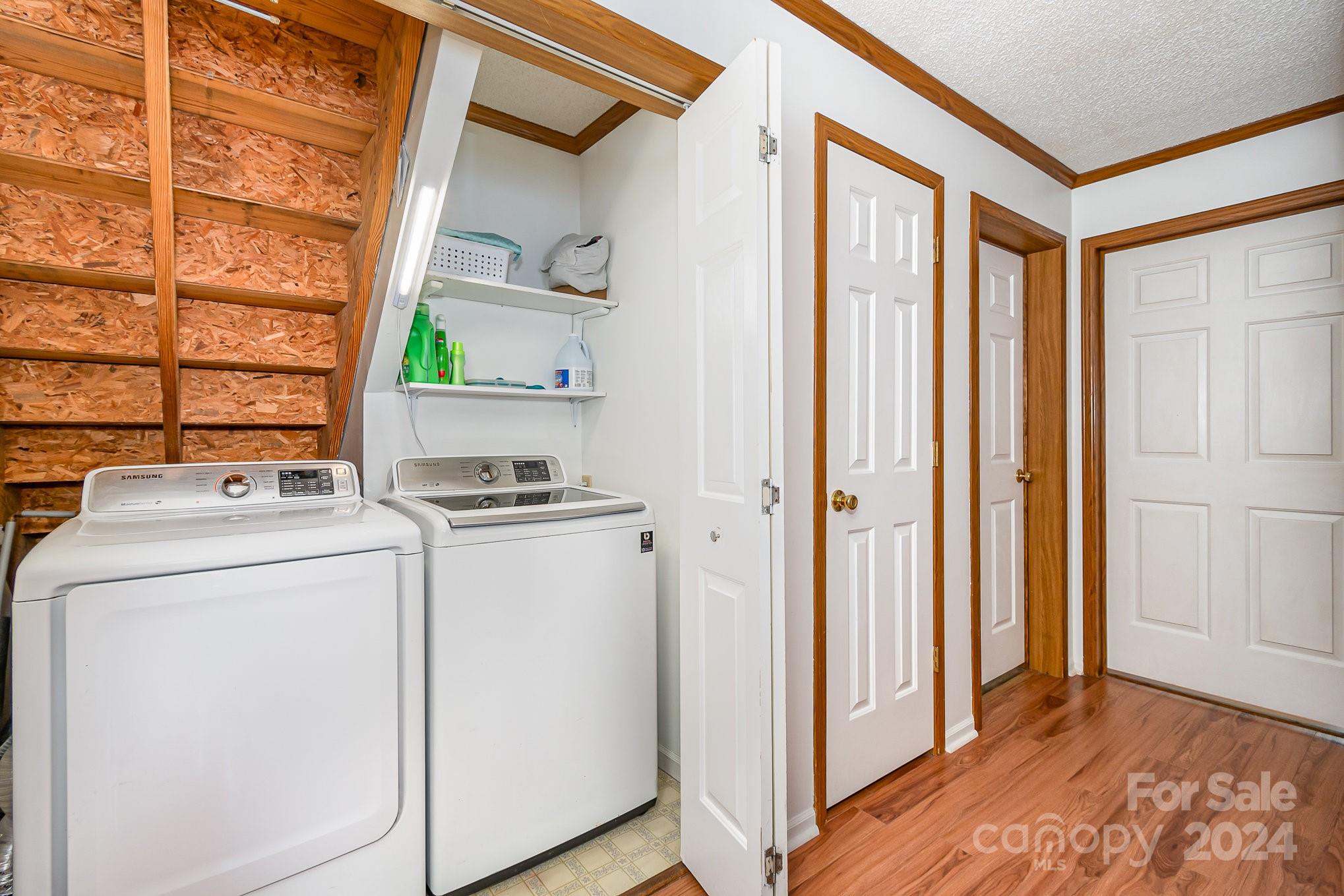 710 Rothrock Road Rockwell, NC 28138 - Photo 8 of 29 a view of washer and dryer with bathroom in the background