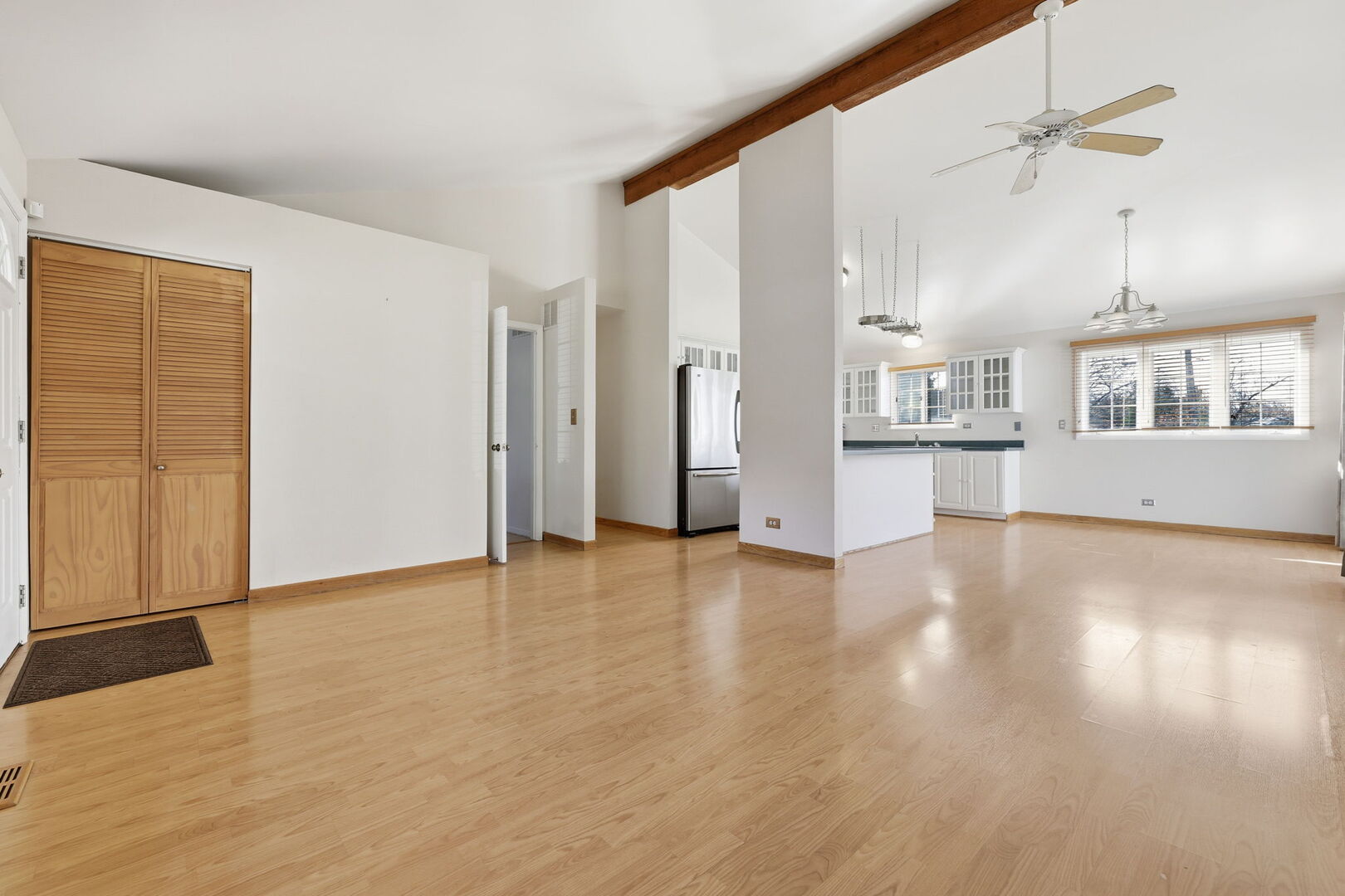 69 Alice Lane Algonquin, IL 60102 - Photo 6 of 14 a view of an empty room with wooden floor and a window