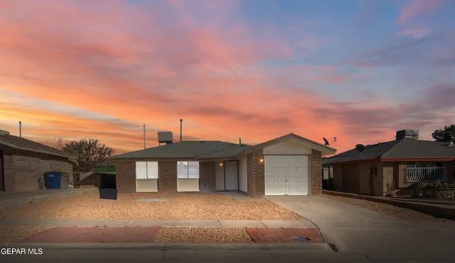 a front view of a house with yard
