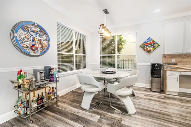 a view of a livingroom with furniture and workspace