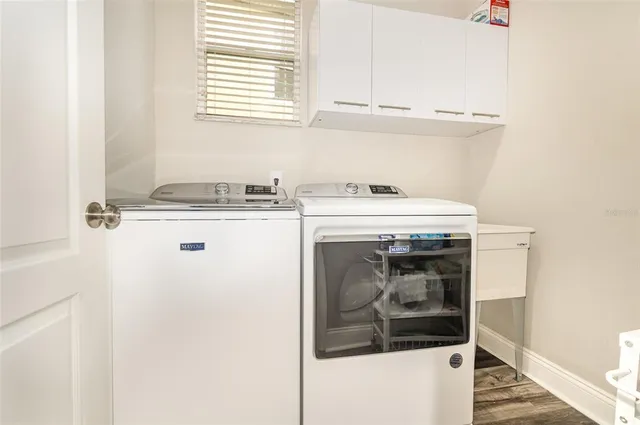 a spacious bedroom with a large bed and a window