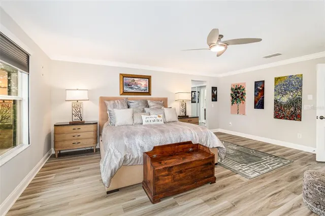 a bathroom with a sink a toilet a mirror and shower