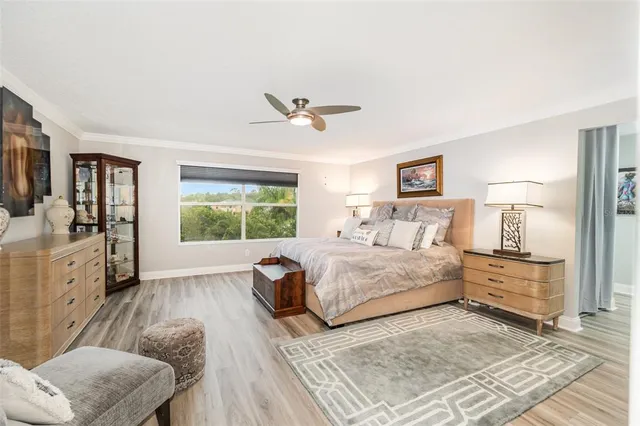 a bathroom with a tub a sink and a large mirror
