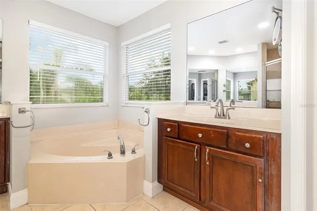 a view of a patio with chairs and table potted plants