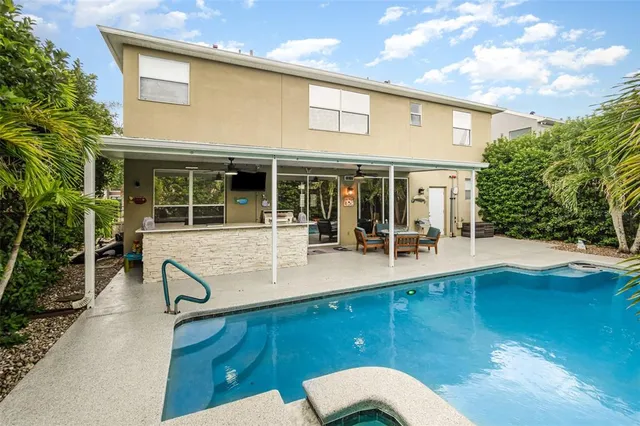 a view of a livingroom with furniture and windows