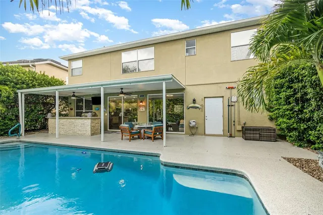 an aerial view of a house with a ocean view