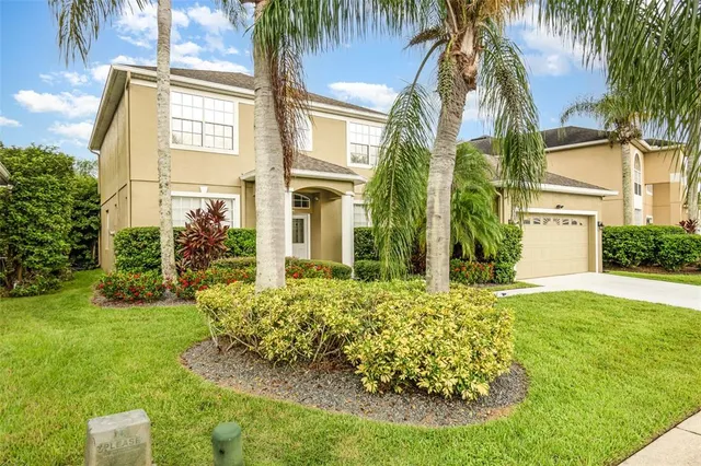 a view of a lake with a house in the background
