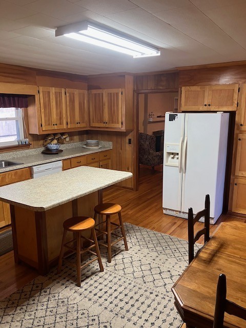 2442 Sherwood Road Sewanee, TN 37375 - Photo 3 of 11 a kitchen with stainless steel appliances a dining table chairs and refrigerator
