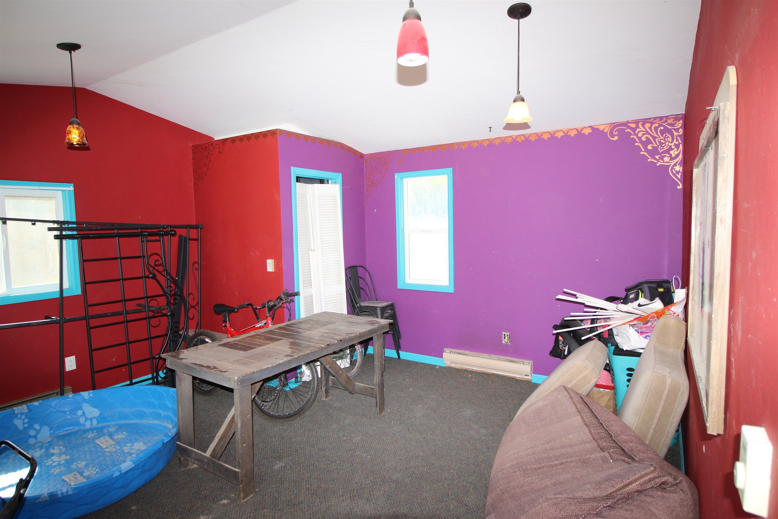 1150 East 7th Street Delta, CO 81416 - Photo 28 of 32 a living room with furniture and a chandelier