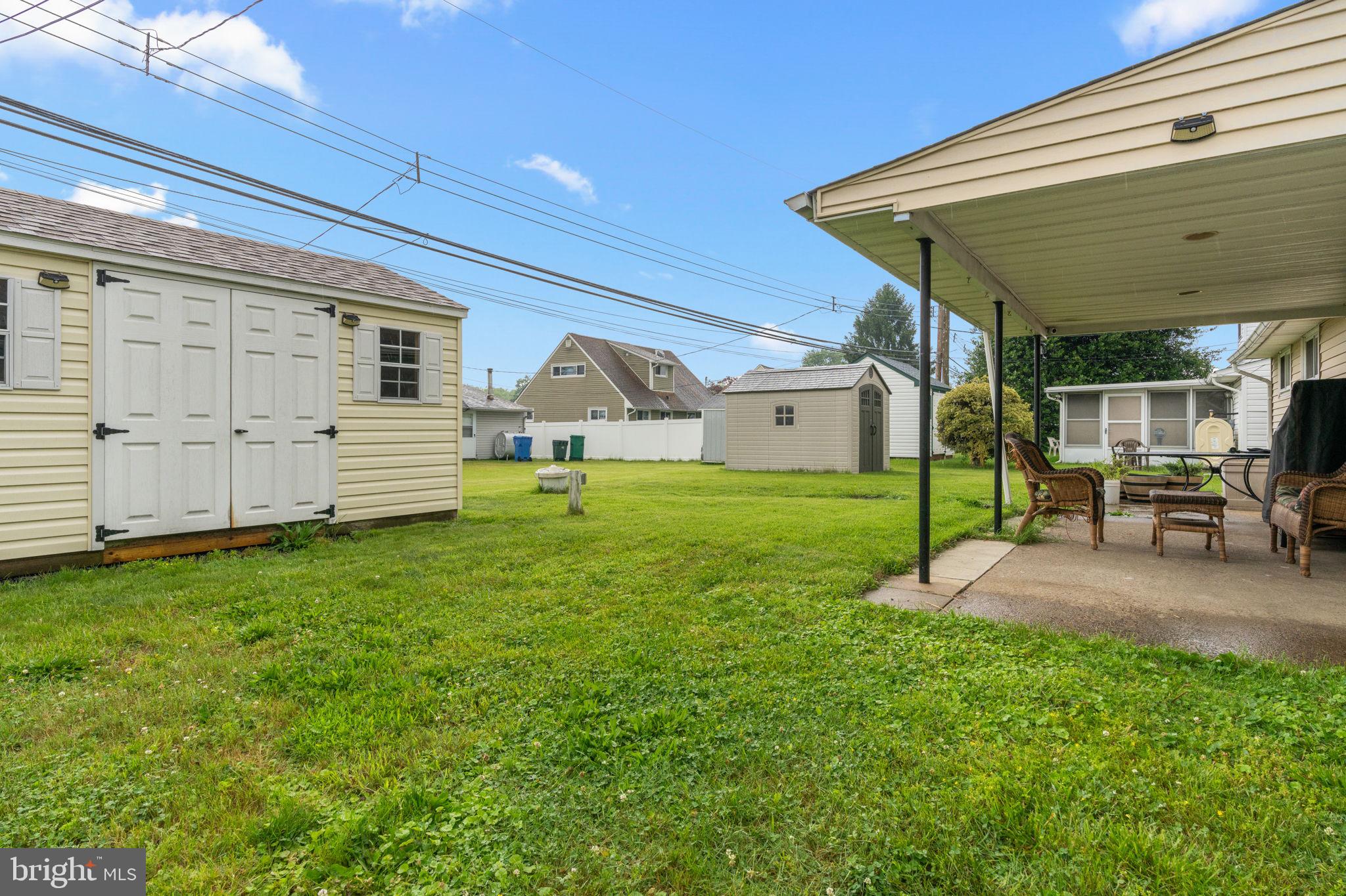 17 Middle Road Levittown, PA 19056 - Photo 18 of 22 a view of a backyard with table and chairs