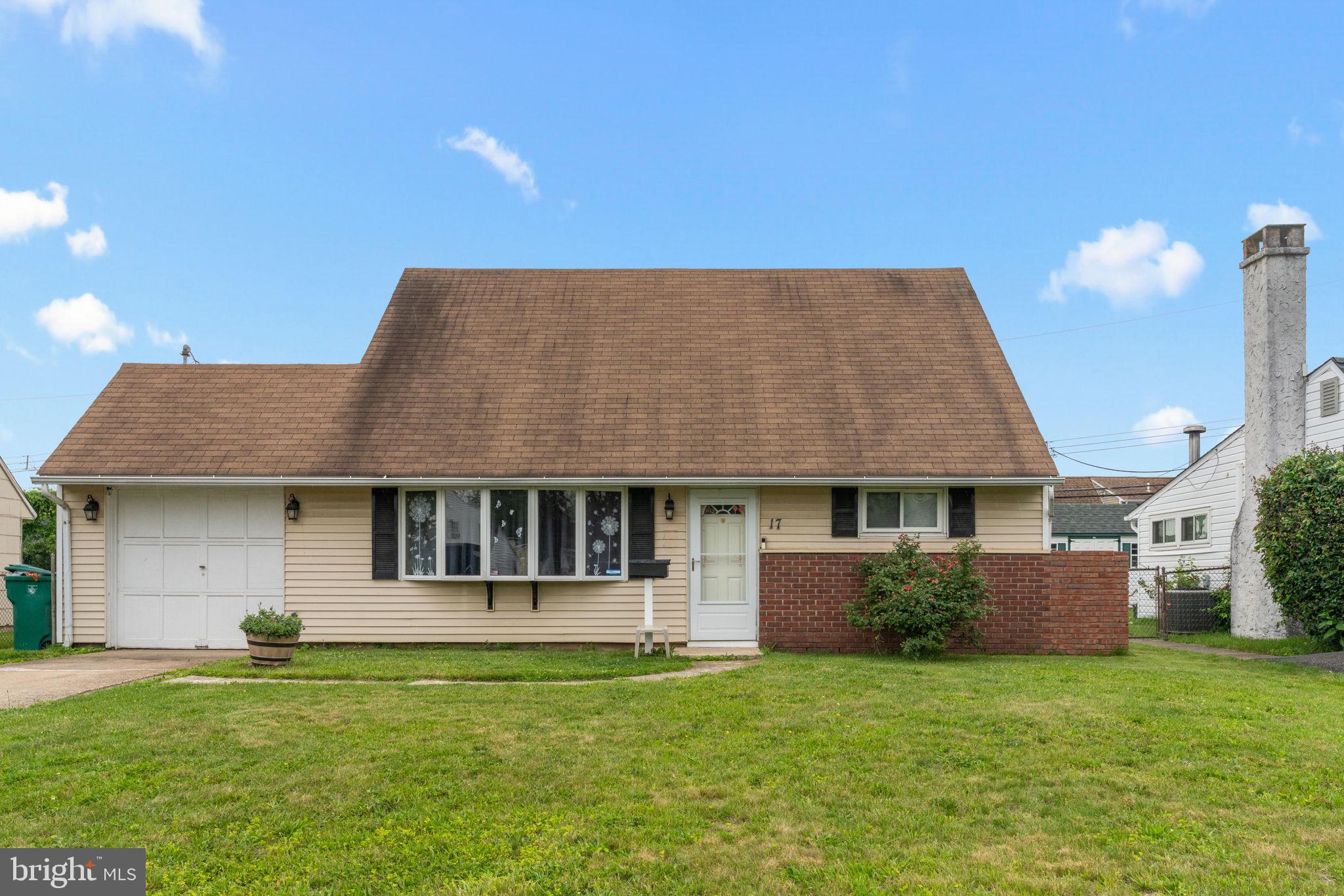 17 Middle Road Levittown, PA 19056 - Photo 22 of 22 a front view of a house with a garden