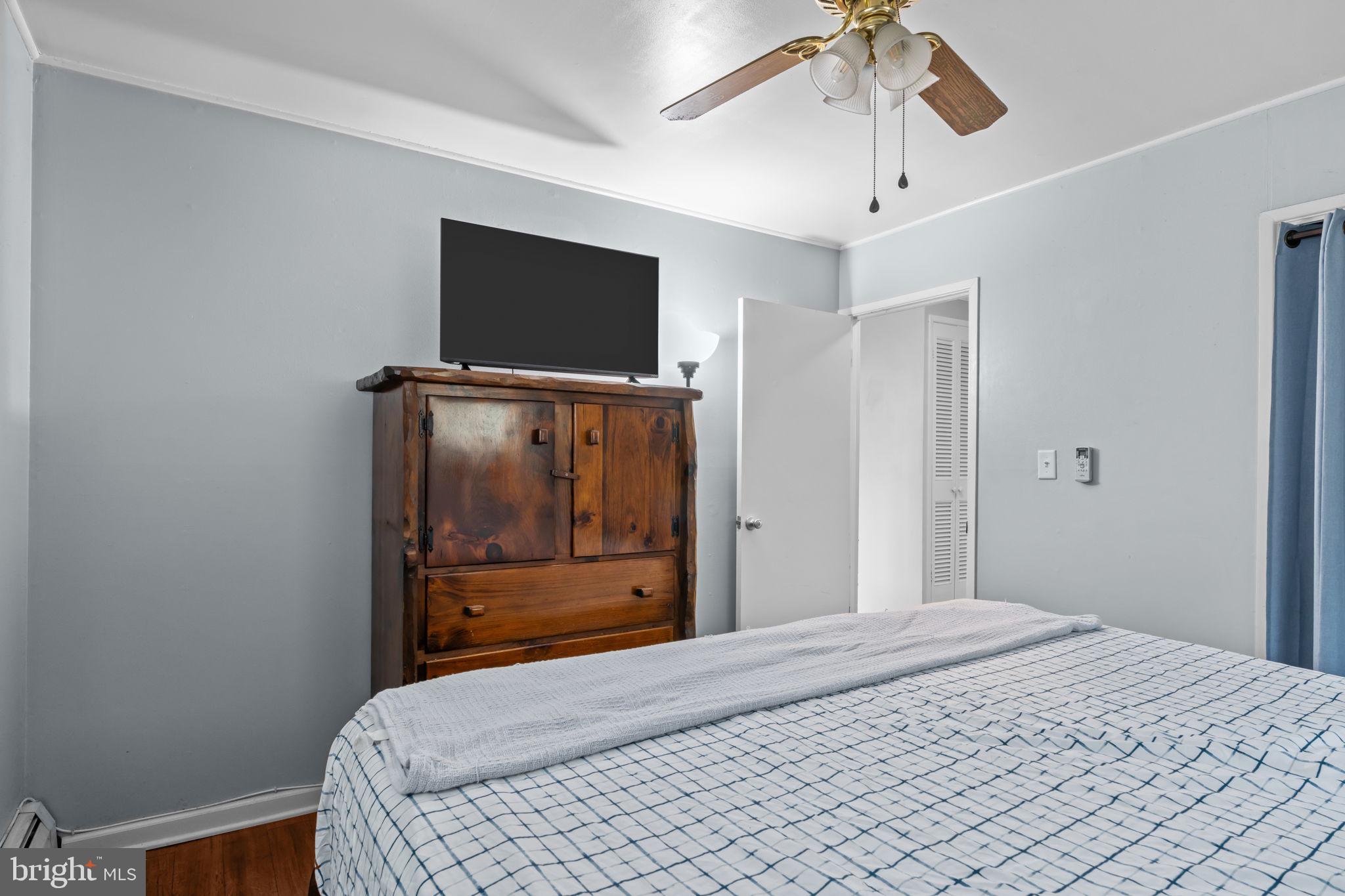 17 Middle Road Levittown, PA 19056 - Photo 10 of 22 a bedroom with a bed and a flat screen tv