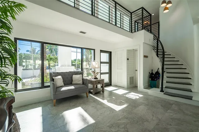 a spacious bathroom with a double vanity sink a mirror and a shower